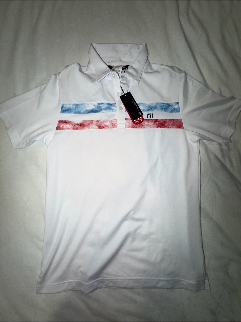 White Men’s Travis Matthew Polo Shirt with Blue & Red Stripes